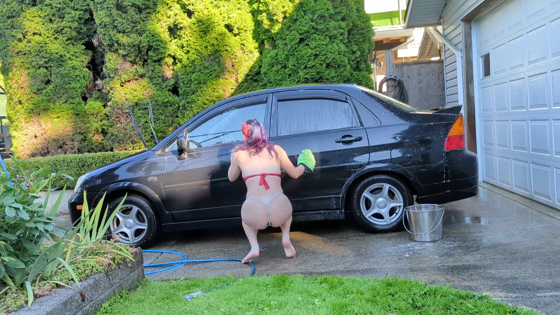 sexy t4t trans woman washes her filthy car for the hungering maw of capitalism with a big glass plug poster