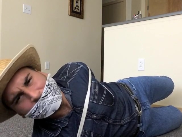 gagged cowboy in tight wranglers poster